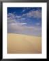 A Cloud-Filled Sky Over A Dune In White Sands National Monument by Raul Touzon Limited Edition Print