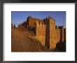 A Man Writes While Standing Near The Massive Walls Of Nineveh by Randy Olson Limited Edition Print