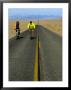 Cycling On The Ca 178 Near Badwater, Death Valley, California, Usa by Roberto Gerometta Limited Edition Print