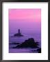 Silhouette Of Lighthouse Against Pink Sky At Sunset, Pointe Du Raz, Brittany, France by Olivier Cirendini Limited Edition Print