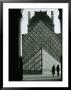Looking Through An Arched Entrance Of The Musee Du Louvre Towards The Glass Pyramid, Paris, France by Mark Newman Limited Edition Print