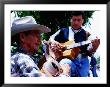 Men Strumming Guitars In Parque Libertad, San Salvador, El Salvador by Anthony Plummer Limited Edition Pricing Art Print