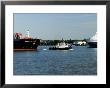 Tug Guiding A Containership Along The River Thames Near Tilbury, England by Martin Page Limited Edition Print