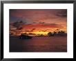 A Passenger Boat Silhouetted On Truk Lagoon At Sunset by Heather Perry Limited Edition Print