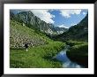 Hiker Along A Stream In A Beartooth Mountains Valley by Kate Thompson Limited Edition Pricing Art Print