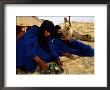 Tuareg Men Preparing For Tea Ceremony Outside A Traditional Homestead, Timbuktu, Mali by Ariadne Van Zandbergen Limited Edition Print