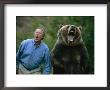 A Man And A Trained Grizzly Bear Snarl For The Camera by Joel Sartore Limited Edition Pricing Art Print