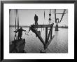 Raising The Truss, Men Of The Raising Gang Ride The Swinging Steel 160 Feet Above The Water by Peter Stackpole Limited Edition Pricing Art Print