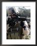 Soldier Looks Through The Scope Of M-4 Carbine Rifle by Stocktrek Images Limited Edition Print