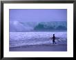 Surfer Entering Shorebreak At Hossegor Near Biarritz, Biarritz, Aquitaine, France by Gareth Mccormack Limited Edition Print