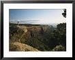 A Man Atop Red Rock Canyon Overlook In Colorado National Monument by Richard Nowitz Limited Edition Print