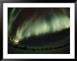 The Aurora Borealis Glows Brightly Over Churchill From Late November Through Late March by Norbert Rosing Limited Edition Print