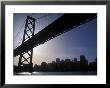 Silhouette Of The Skyline And Oakland Bay Bridge, California by Rich Reid Limited Edition Print