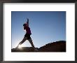 Woman Stretching, Monument Valley Navajo Tribal Park, Arizona Utah Border by Angelo Cavalli Limited Edition Print