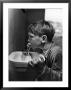 Young Boy Drinking From A Water Fountain by Allan Grant Limited Edition Pricing Art Print