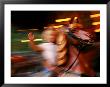 Child On Carousel At Grona Lund Amusement Park, Stockholm, Sweden by Nancy & Steve Ross Limited Edition Print