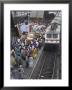 Train Ariving At Crowded Platform In New Delhi Train Station, Delhi, India by Eitan Simanor Limited Edition Print