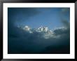 Mount Everest (Left) And Mount Lhotse (Right) Almost Obscured By Clouds by Michael Klesius Limited Edition Print