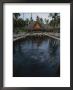 A Swimmer Takes A Relaxing Dip In A Resort Pool by Jodi Cobb Limited Edition Print