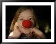 A Young Female Sports A Bright Red Clown Nose by Joel Sartore Limited Edition Print