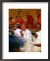 Nuns Praying At Pha That Luang Temple During The Full Moon Temple Festival, Vientiane, Laos by Juliet Coombe Limited Edition Print
