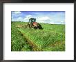 Tractor Cutting Grass Meadow For Silage Farming, Uk by Mark Hamblin Limited Edition Print