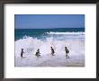 Children Playing In The Surf, Near Gosford, New South Wales, Australia by Ken Wilson Limited Edition Print