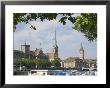 Boats On The Limmat River With St. Peter Church And Fraumunster Church Behind, Zurich, Switzerland by Christian Kober Limited Edition Print