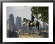 The Scout, A Statue Of A Native American And A Horse, Overlooks A City by Michael S. Lewis Limited Edition Print