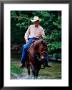 Cowboy On Horse In Medina River, Mayan Dude Ranch, Bandera, Texas by Holger Leue Limited Edition Print