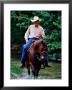 Cowboy On Horse In Medina River, Mayan Dude Ranch, Bandera, Texas by Holger Leue Limited Edition Print