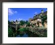 Historic Bridge And Riverfront Houses, Castle Combe, United Kingdom by John Banagan Limited Edition Print