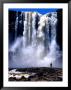 Person Standing In Front Of Aponguao Falls (Chinak Meru), Gran Sabana, Venezuela by Krzysztof Dydynski Limited Edition Pricing Art Print