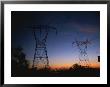 Power Lines And Towers Silhouetted Against The Evening Sky by Taylor S. Kennedy Limited Edition Print