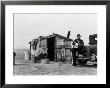 Migrant Father Cradling His Baby Outside Shanty by Dorothea Lange Limited Edition Pricing Art Print