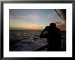Silhouette Of A Woman On A Cruise Ship Looking At The Sunset by Todd Gipstein Limited Edition Print