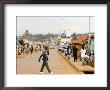 Man Crossing Road And People On Footpath, Kigali, Rwanda by Ariadne Van Zandbergen Limited Edition Print