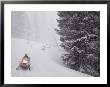 A Group Of Snowmobilers Turn A Corner In A Snowstorm by Taylor S. Kennedy Limited Edition Print