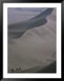 Sand-Boarders Dwarfed By 130M High Sand Dunes Of Huacachina, Huacachina, Ica, Peru by Mark Daffey Limited Edition Print