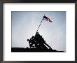 The Iwo Jima Memorial Silhouetted With Flag Flying by Stephen St. John Limited Edition Pricing Art Print