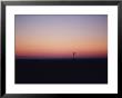 A Windmill Breaks The Flat Horizon Of The Texas Panhandle At Dawn by George F. Mobley Limited Edition Print