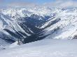 A Back-Country Snowboarder Descends A Snowfield Near Rogers Pass by Skip Brown Limited Edition Print