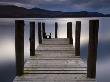 Wooden Jetty Stretches Out Into Derwent Water, Lake District National Park, Cumbria, England, Uk by Adam Burton Limited Edition Print