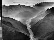 Aerial View Of Yangtze River Gorge Shrouded In Mist With River Winding Through Steep Rocky Hills by Dmitri Kessel Limited Edition Print