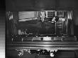 Man Looking At Book Behind Open Door At Vault In The New York Public Library by Alfred Eisenstaedt Limited Edition Pricing Art Print