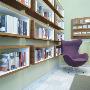 Liebeskind Publishers Bookshop, Munich Germany, Chair By Shelves In Corner Of Room by James Balston Limited Edition Print