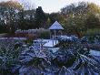 The Summerhouse And Wooden Bridge Across The Pool In Winter With Cornus And Gunnera Manicata by Clive Nichols Limited Edition Pricing Art Print