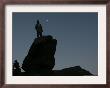 An Afghan Man Stands On A Huge Rock Next To The Now Abad Dinazung Monument by Rodrigo Abd Limited Edition Print