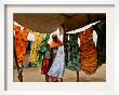 A Sudanese Woman Buys A Dress For Her Daughter At The Zamzam Refugee Camp by Nasser Nasser Limited Edition Print
