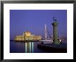 Entrance To Mandraki Harbour At Dusk, Greece by Ian West Limited Edition Print